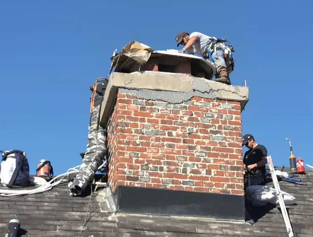 Wickliffe Chimney Sweep installing a custom chimney crown in Wickliffe, OH