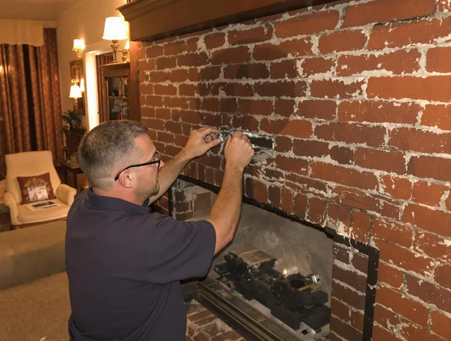 Wickliffe Chimney Sweep expert fixing a fireplace in Wickliffe, OH